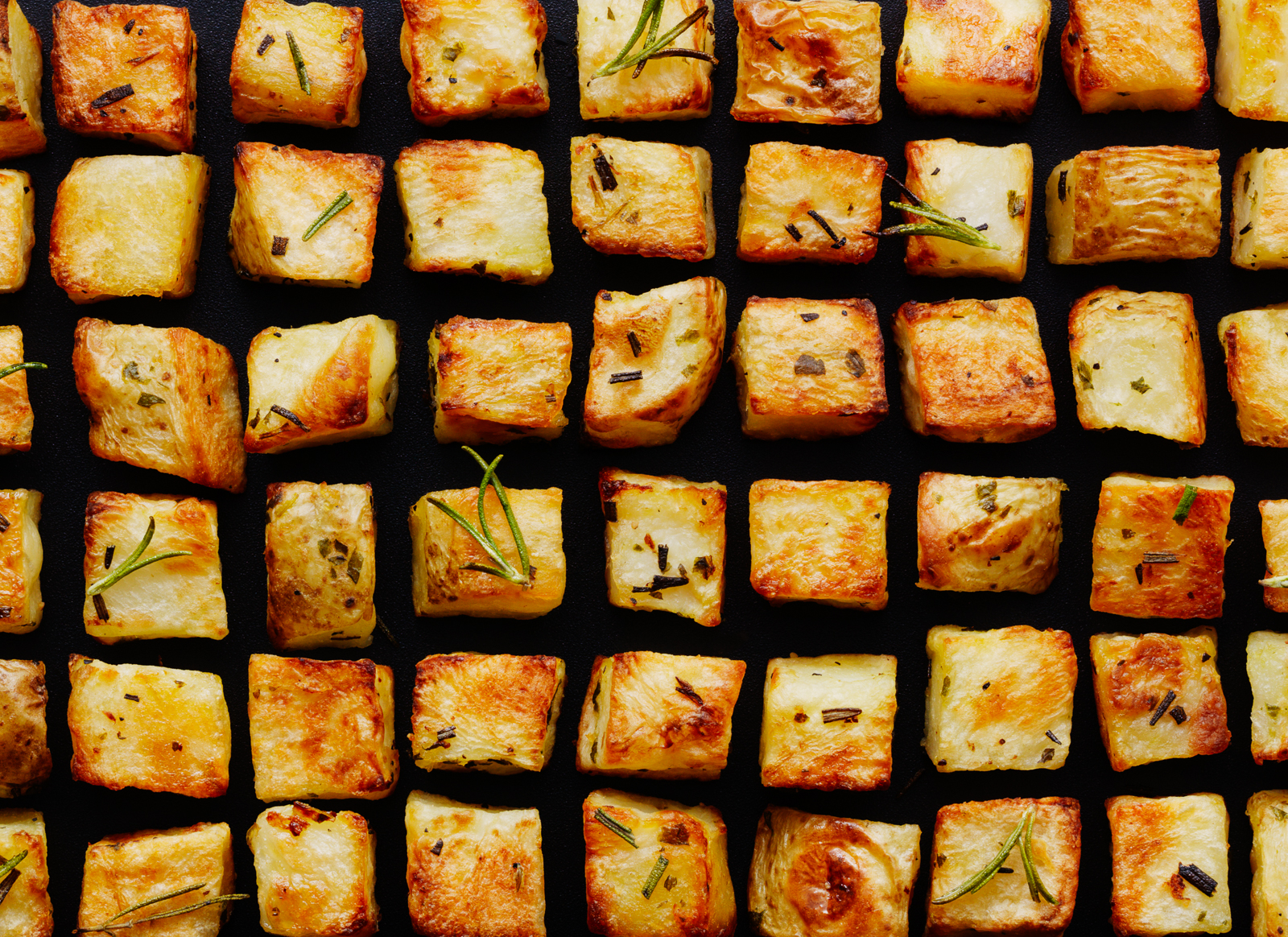 Photograph of Cubes of Roasted Potato with rosemary