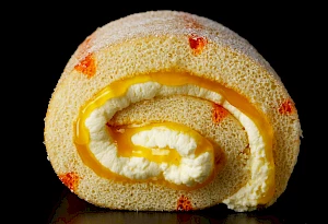 Photograph of a sweet roulade with cream filling