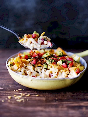 Photograph of Macaroni and Cheese in a pan with spoon out