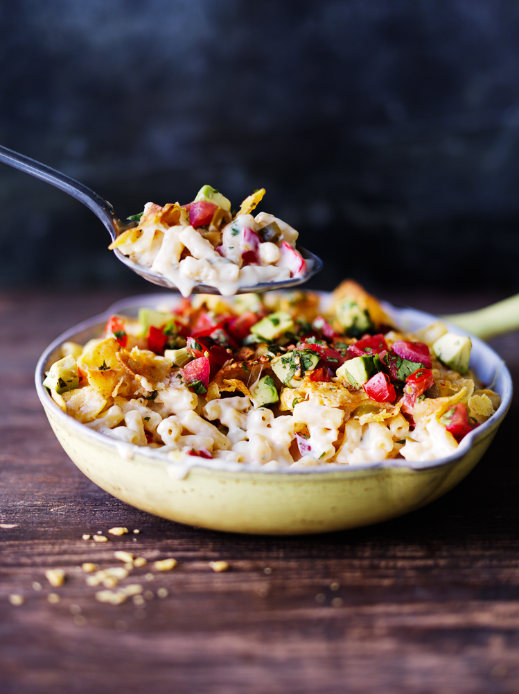 Photograph of Macaroni and Cheese in a pan with spoon out