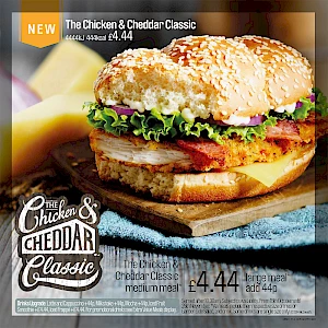 Advert for Chicken and Cheddar Classic Burger. Photograph of burger on a board.
