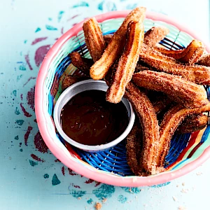 Photograph of Thomasina Miers Churros with chocolate sauce from an article for Daily Mail Weekend Magazine.