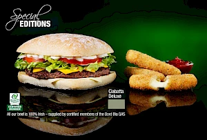 Advert for special editions. Photograph of a burger with cheese dippers
