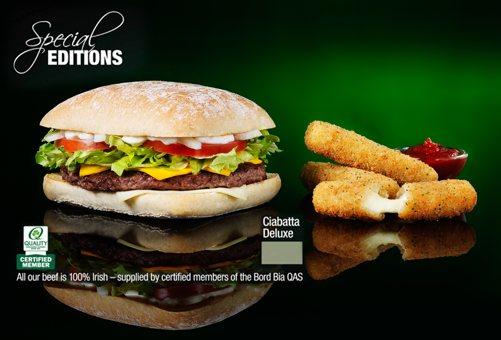 Advert for special editions. Photograph of a burger with cheese dippers