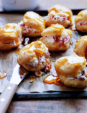 Photograph of Summer Berry Puffs on a baking tray with palette knife