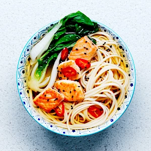 Photograph of Waitrose bowl of noodles with salmon and bok choy in a broth