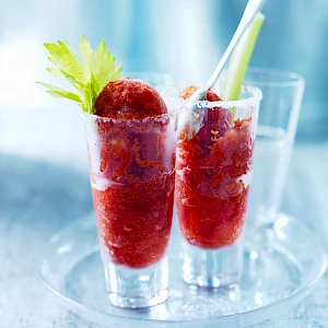 Photograph of a Bloody Mary Sorbet in glasses with celery