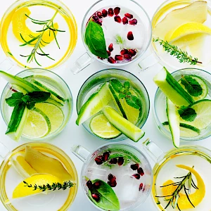 Photograph of fruit infusions drinks taken from overhead with lots of garnishes