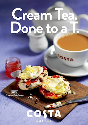 Photograph of a cream tea with pot of tea