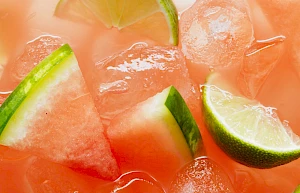Close-Up Detail of Watermelon Drink with Lime Wedges