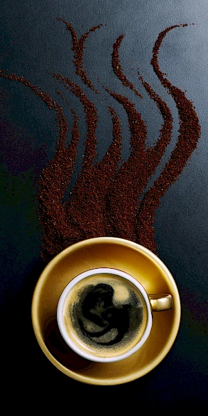 Cup of Coffee with Ground Coffee Pattern of Steam