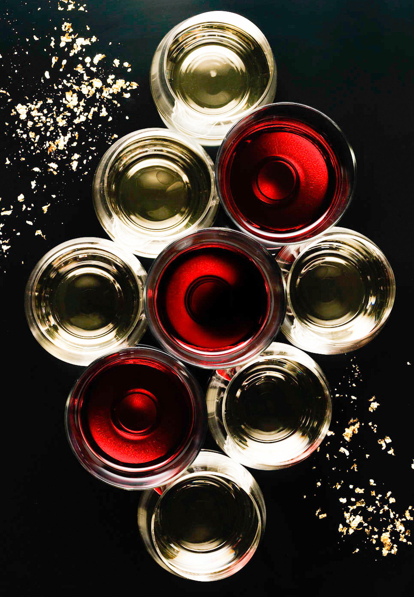 Overhead Close Up of Wine Glasses With White and Red Wine Pattern