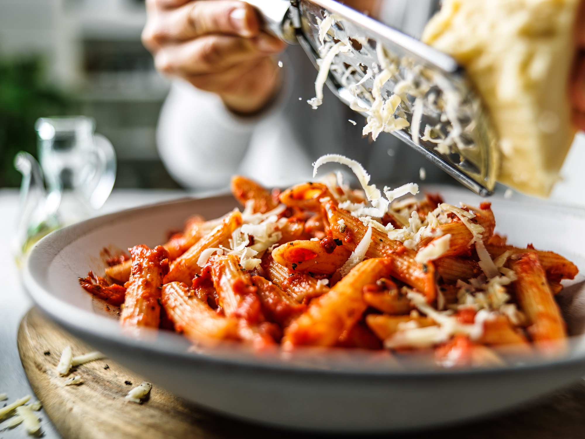 Penne pasta with grated cheese