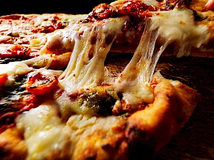 Pizza close up with cheese pull